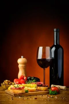 Tapas snacks and red wine Stock Photos