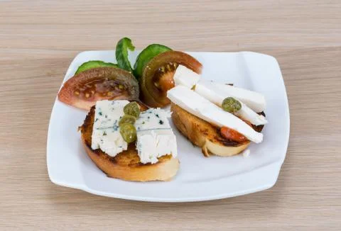 Tapas with soft cheese Stock Photos