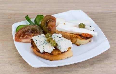 Tapas with soft cheese Stock Photos