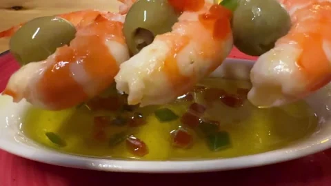 Tapas: Spanish Cuisine. Closeup View of Shrimp Skewer with Olives on a White Stock Footage 333494910