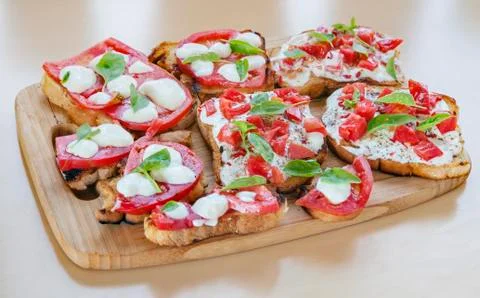 Tapas toasts cheese tomatoes Foto stock