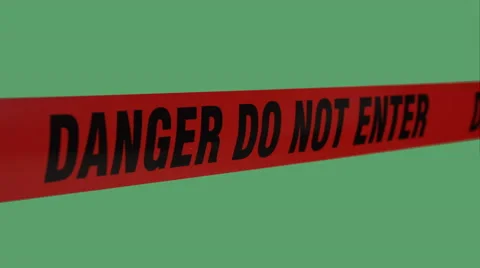 Tape barrier "danger, do not enter" in the wind on green screen. Stock-Footage 57525876