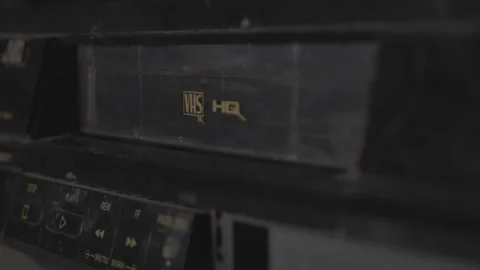 Tape being Placed into VHS Player Close Up Slide Stock Footage 130336931