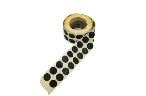 Tape of black rubber bands to patch the targets of the shooting range. On white Fotos de archivo