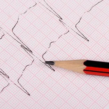 The tape with the cardiogram of a man Stock Photos