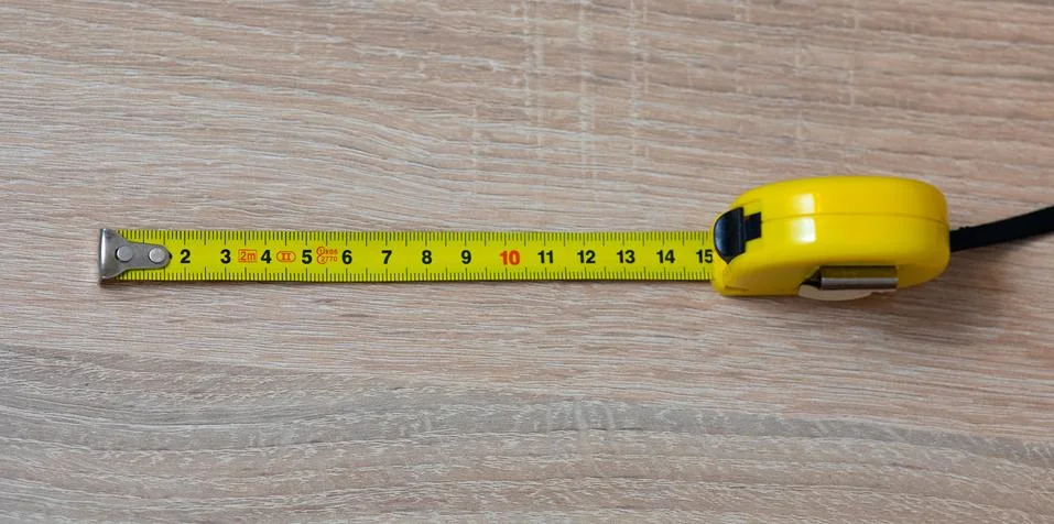 Tape measure on the table. Stock Photos