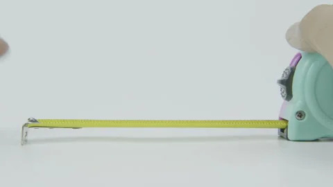 Tape Measure in Use for Measuring Concept on White Background Stock Footage 292045660