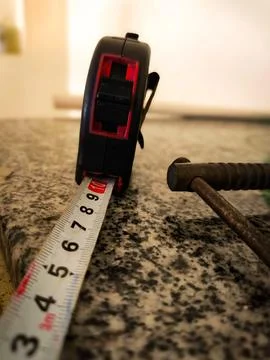 Tape measure on workbench Stock Photos