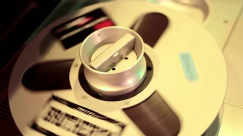 Tape reels spinning on 24-track audio deck Stock Footage
