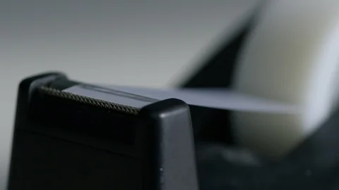 Tape remove from tape dispenser Stock Footage 107936872