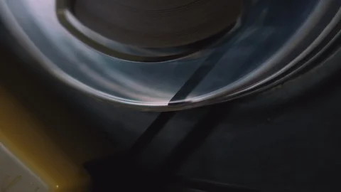 Tape Rolling on a Turntable for Opening Title Sequence Stock Footage 91320686
