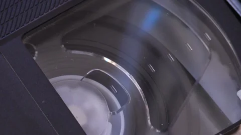Tape is spinning inside the old VHS videotape Stock Footage 136944026