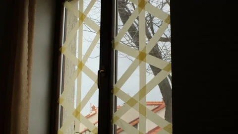 Tape on windows to prevent fragments from explosion during the war in ukraine Stock Footage 174862594