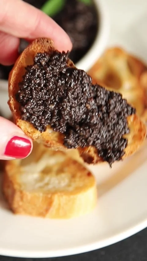 Tapenade black olives olive spread ready to eat tasty snack fresh gourmet food Stock Footage 336678475