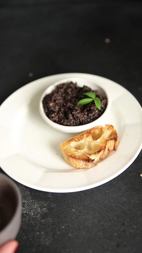 Tapenade black olives olive spread ready to eat tasty snack fresh gourmet food Stock Footage 336678484