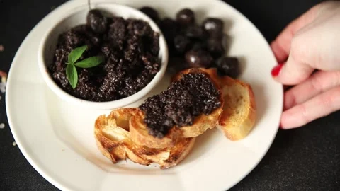 Tapenade black olives olive spread ready to eat tasty snack fresh gourmet food Stock Footage 336678485