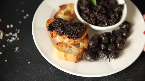 Tapenade black olives olive spread ready to eat tasty snack fresh gourmet food Stock Footage 336678488