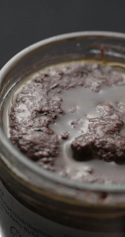 Tapenade bottle opening slow motion, vertical view Stock-Footage 280523259