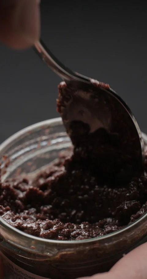 Tapenade bottle preparation slow motion, vertical view 스톡 동영상 280523261