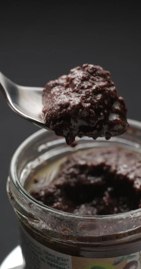 Tapenade  tasting slow motion, vertical view Stock-Footage 280523335