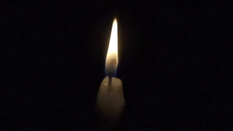 Taper candle is blown out in slow motion Stock Footage 101072454