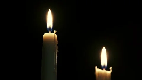 Taper candles flicker in a dark room Stock Footage 101072715