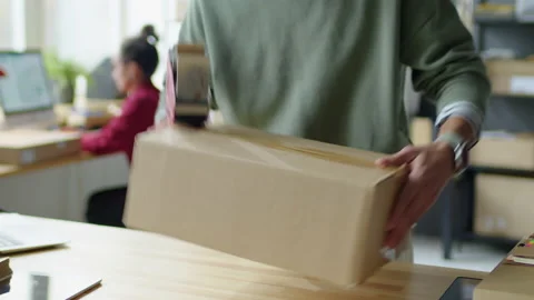 Taping Parcel Box before Shipping Stock Footage 228494439
