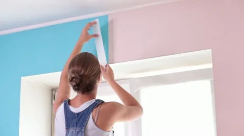 Taping the Wall and Smiling Stock Footage 12009817