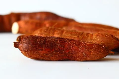 Tapioca also known as cassava roots or yuca or manioc, on a clean white backg Stock Photos