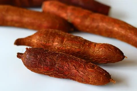 Tapioca also known as cassava roots or yuca or manioc, on a clean white backg Stock Photos
