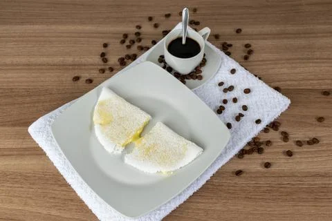 Tapioca with melted mozzarella cheese and coffee. On a wooden table. Stock Photos