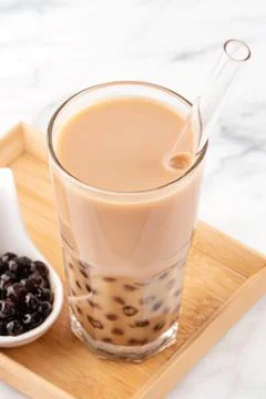 Tapioca pearl ball bubble milk tea, popular Taiwan drink, in drinking glass w Stock Photos