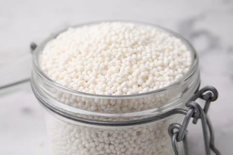 Tapioca pearls in jar on table, closeup Stock Photos