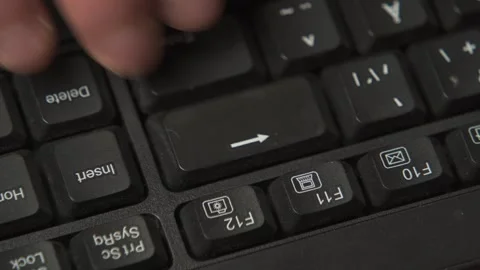 Tapping backspace key close up macro 動画素材 335915791