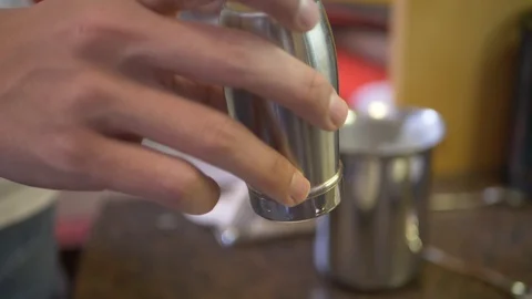 Tapping cinnamon onto a cappuccino Stock Footage 126946374