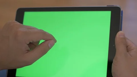 Tapping Greenscreen on Ipad Stock Footage 116843971