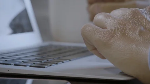 Tapping laptop close up. Man hands typing on the keyboard. Working from home  Stock Footage 128115156