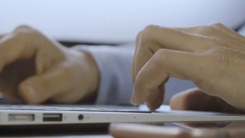 Tapping laptop close up. Man hands typing on the keyboard. Working from home Stock Footage 128115580