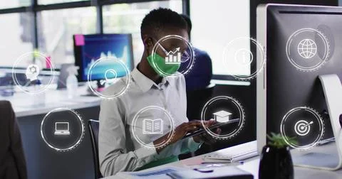 Tapping office worker in light button-up shirt holding tablet at office with Stock Photos
