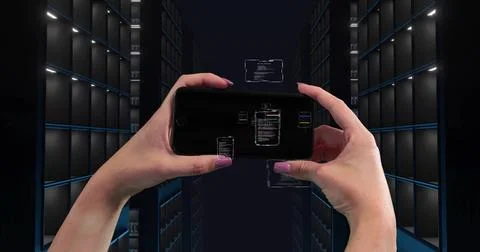 Tapping painted-nail hands reacting to holo UI appearing on phone in server Stock Photos