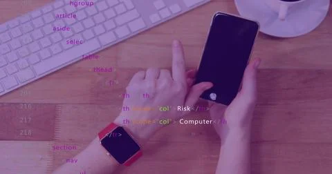 Tapping person's left finger touching phone on wooden desk, showing red Fotos de archivo