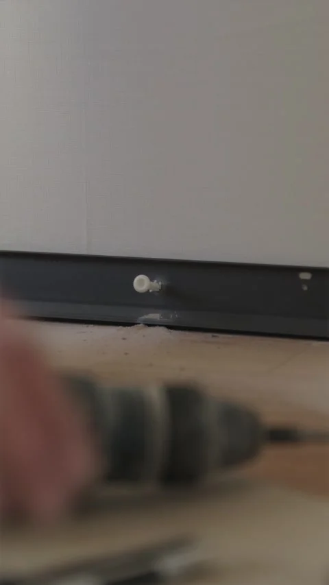 Tapping plastic wall anchor plug into drilled hole with hammer Stock-Footage 346396779