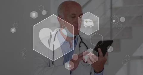 Tapping senior physician checking records in clinic, in lab coat, hex icons Stock Photos