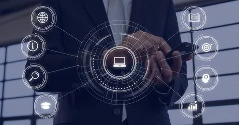 Tapping smartphone businessman projecting interface near office windows, showing Stock Photos