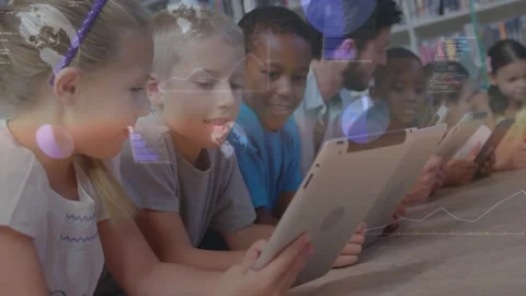 Tapping students and adult using tablets at table in library for learning as Stock Footage 332285451