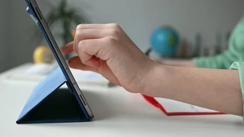 Tapping tablet closeup during online course Stock Footage 168513383