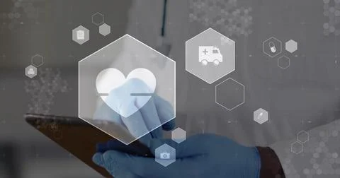 Tapping tablet senior doctor working in clinic wearing lab coat, blue gloves, Stock Photos