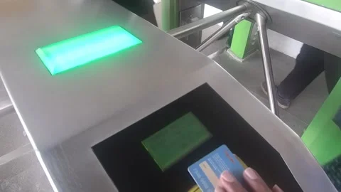 Tapping ticket at the ticket gate of the commuter line station Stock Footage 309974086
