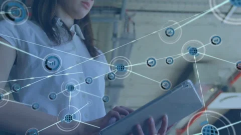 Tapping woman with tablet in white-top as node graphic appearing above it, Stock Footage 333963182