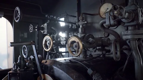 Taps inside vintage steam train driver control stand cab compartment Video stock 70434395